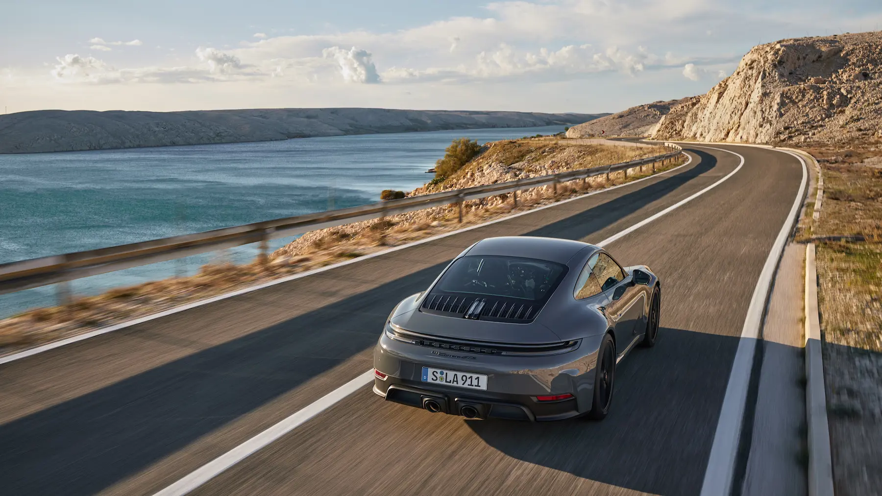 Luxury car on coastal road